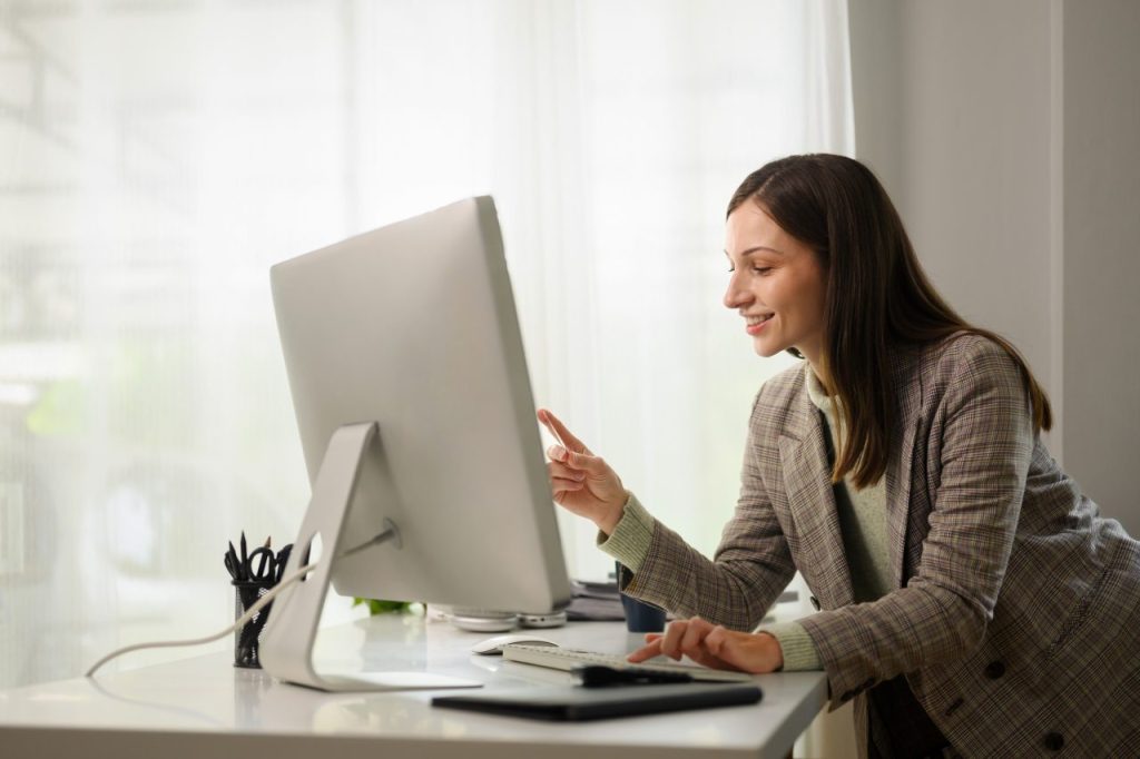 attractive businesswoman talking by conference online virtual chat on computer at home office